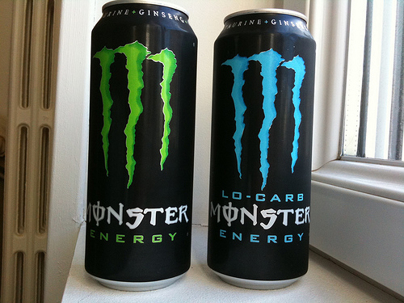 two monster energy drinks.