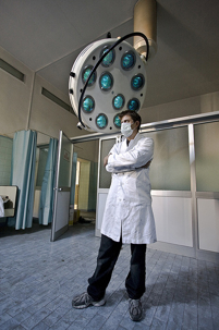 a doctor standing in front of equipment