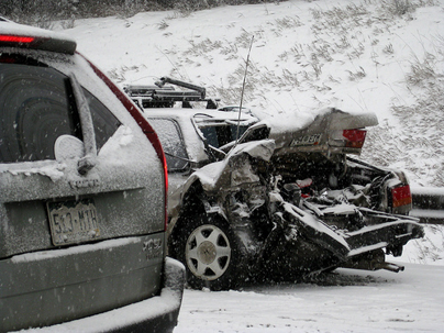a wrecked car in the snow