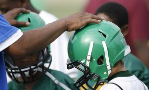 a couch touching two helmets